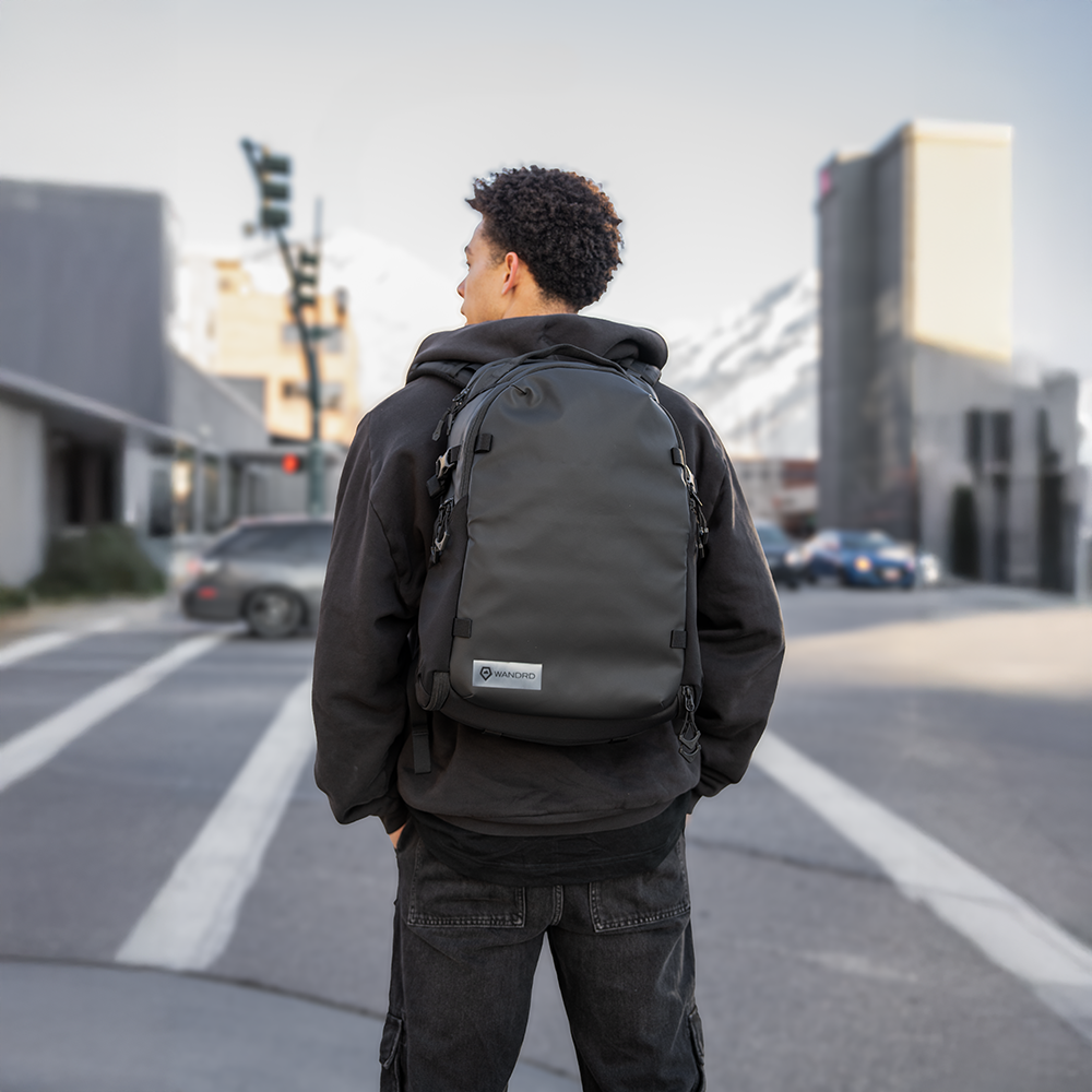 Man wearing Black Stratus Photo 18L Backpack Back